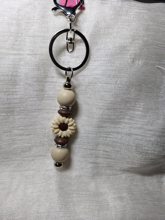 Porte clé pâquerette et feuilles