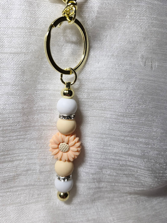 Porte clé pâquerette et feuilles